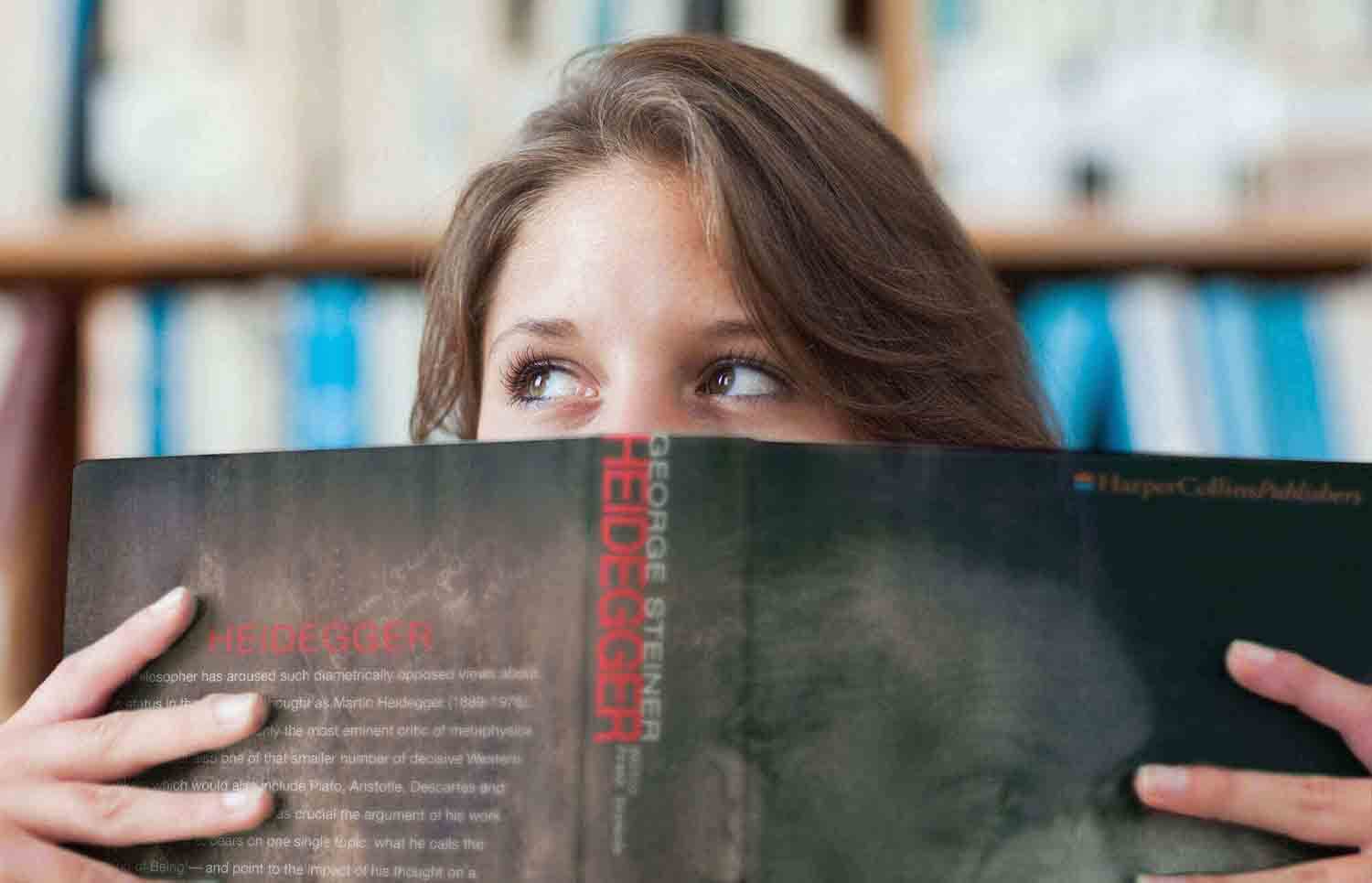 A Woman Reading biographical Philosophy Book