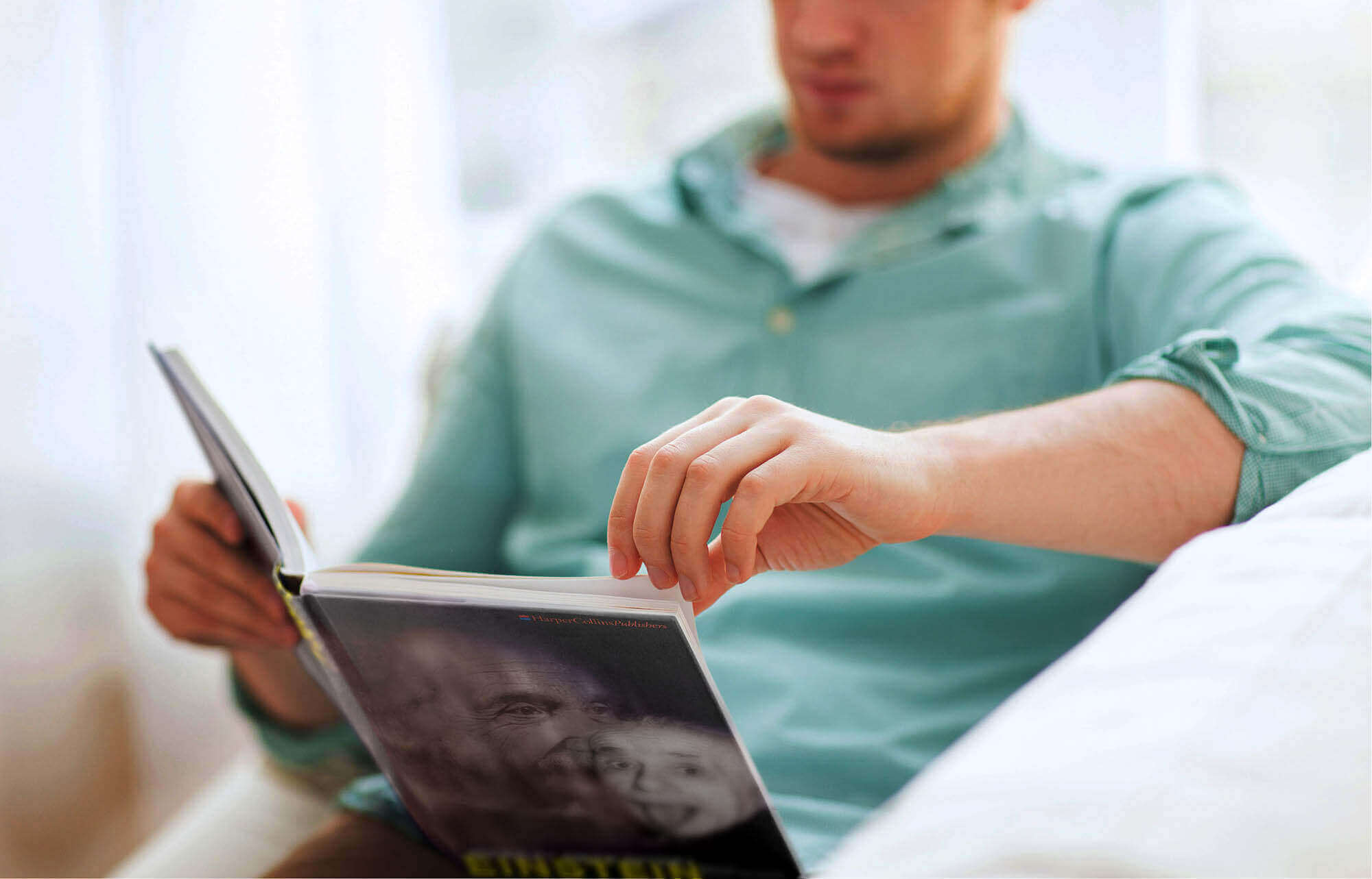 A Man Reading biographical Science Book